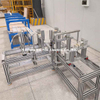 Machine d'assemblage de barres omnibus coudées pour la production de profils de conduits coudés